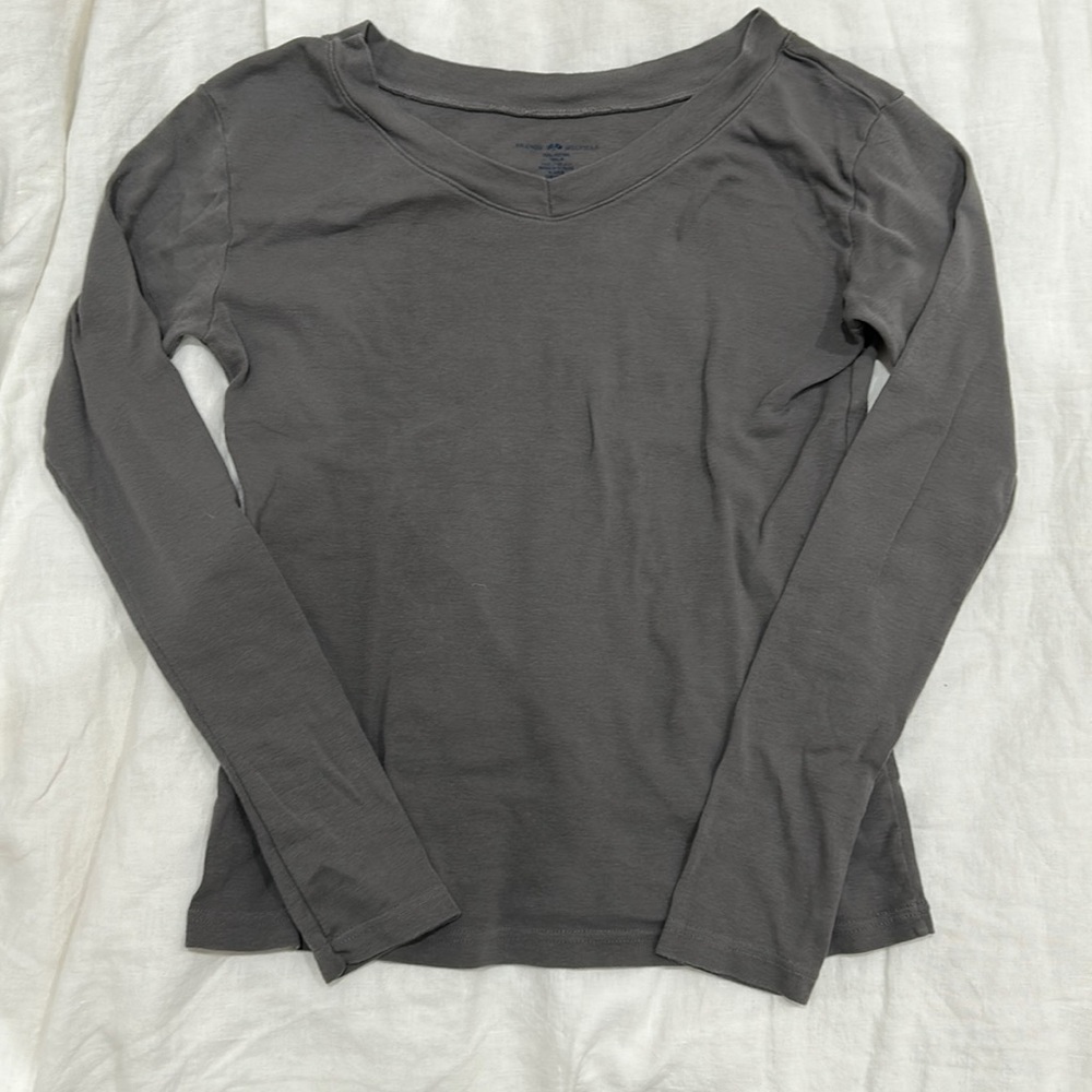 Greyish slight vneck long sleeve.
